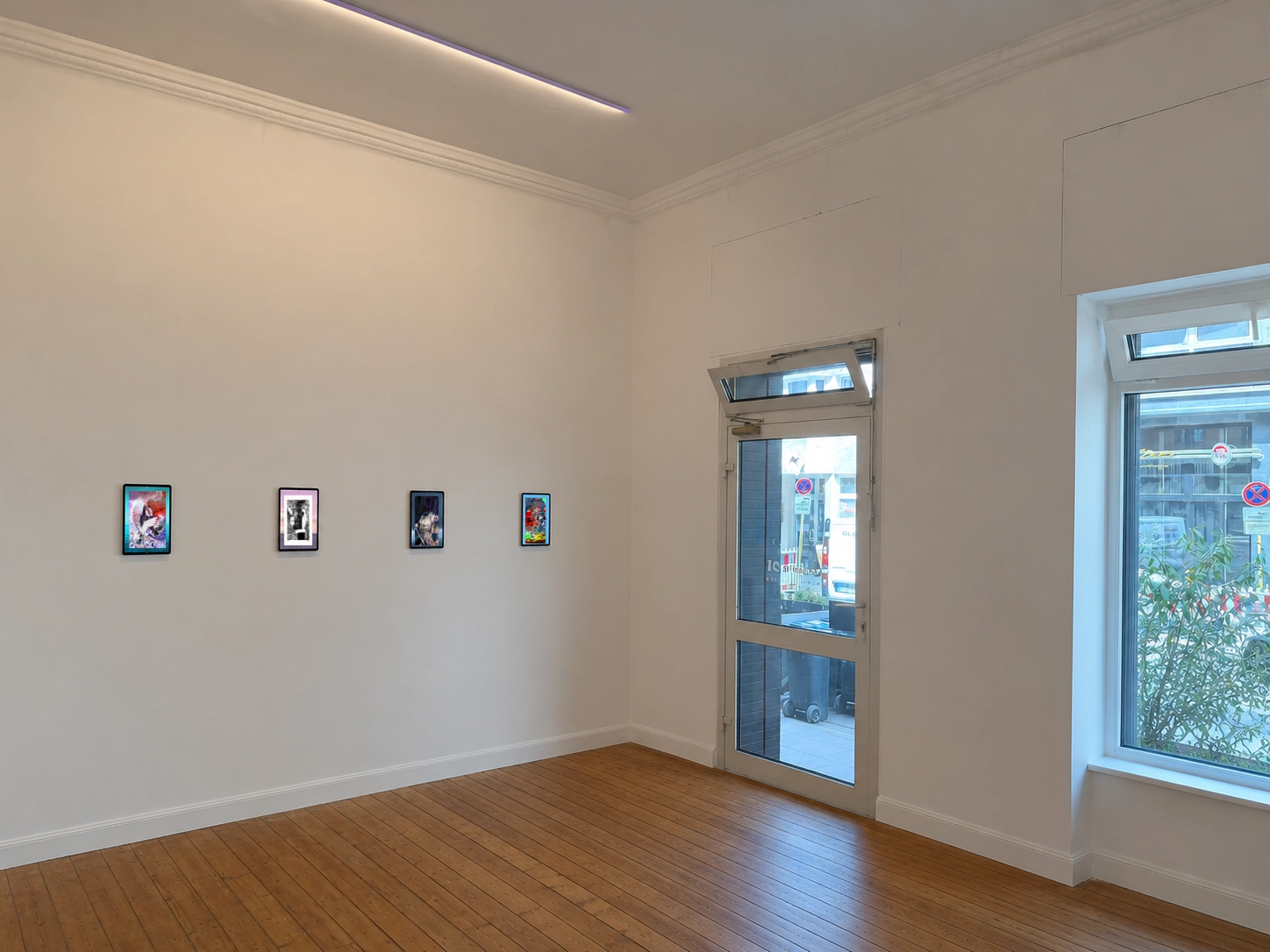 Galerie 21 exhibition room with digital artworks presented on screens